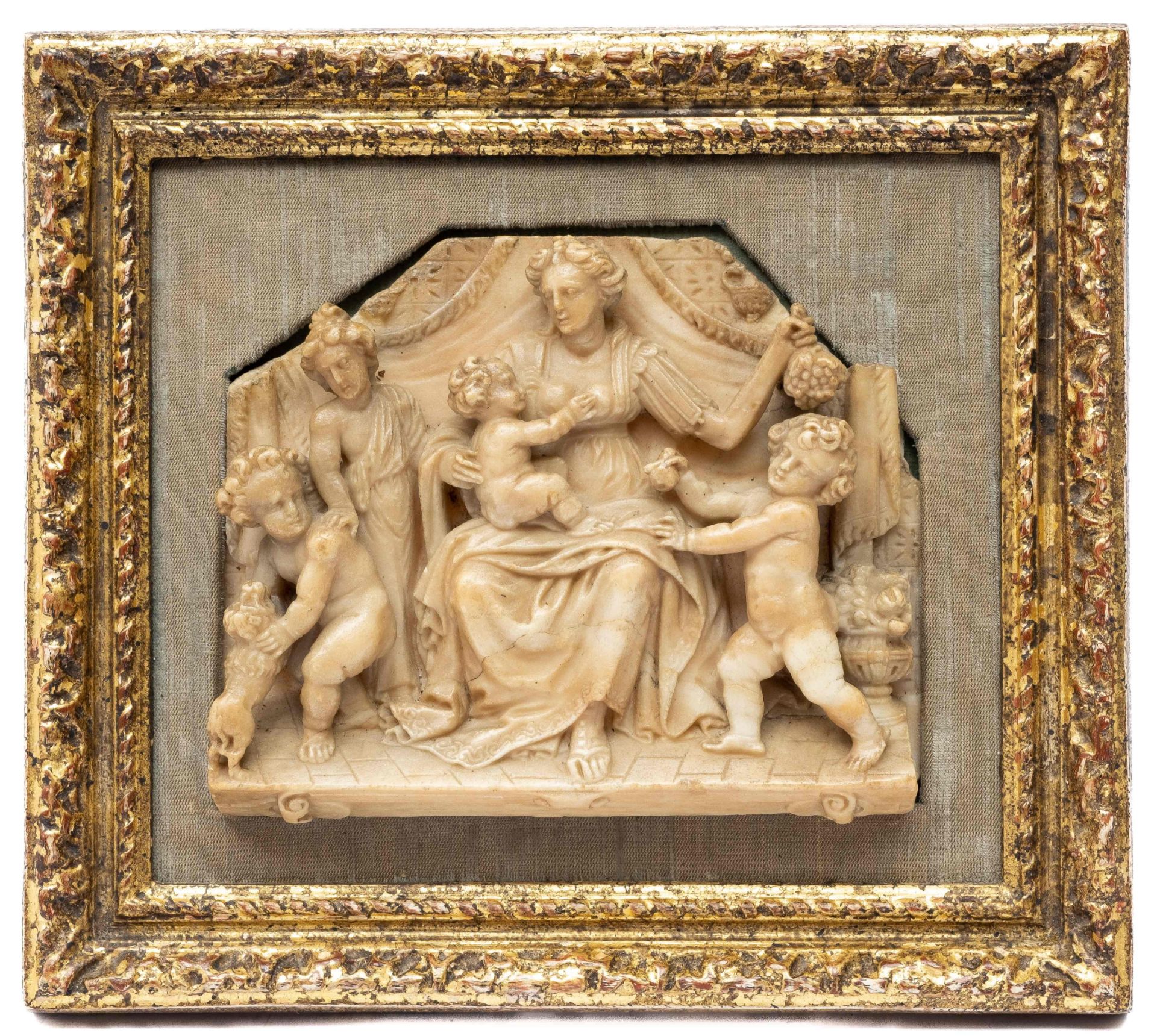 A Mechelen carved alabaster relief representing Charity