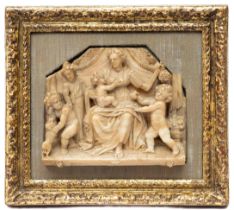 A Mechelen carved alabaster relief representing Charity