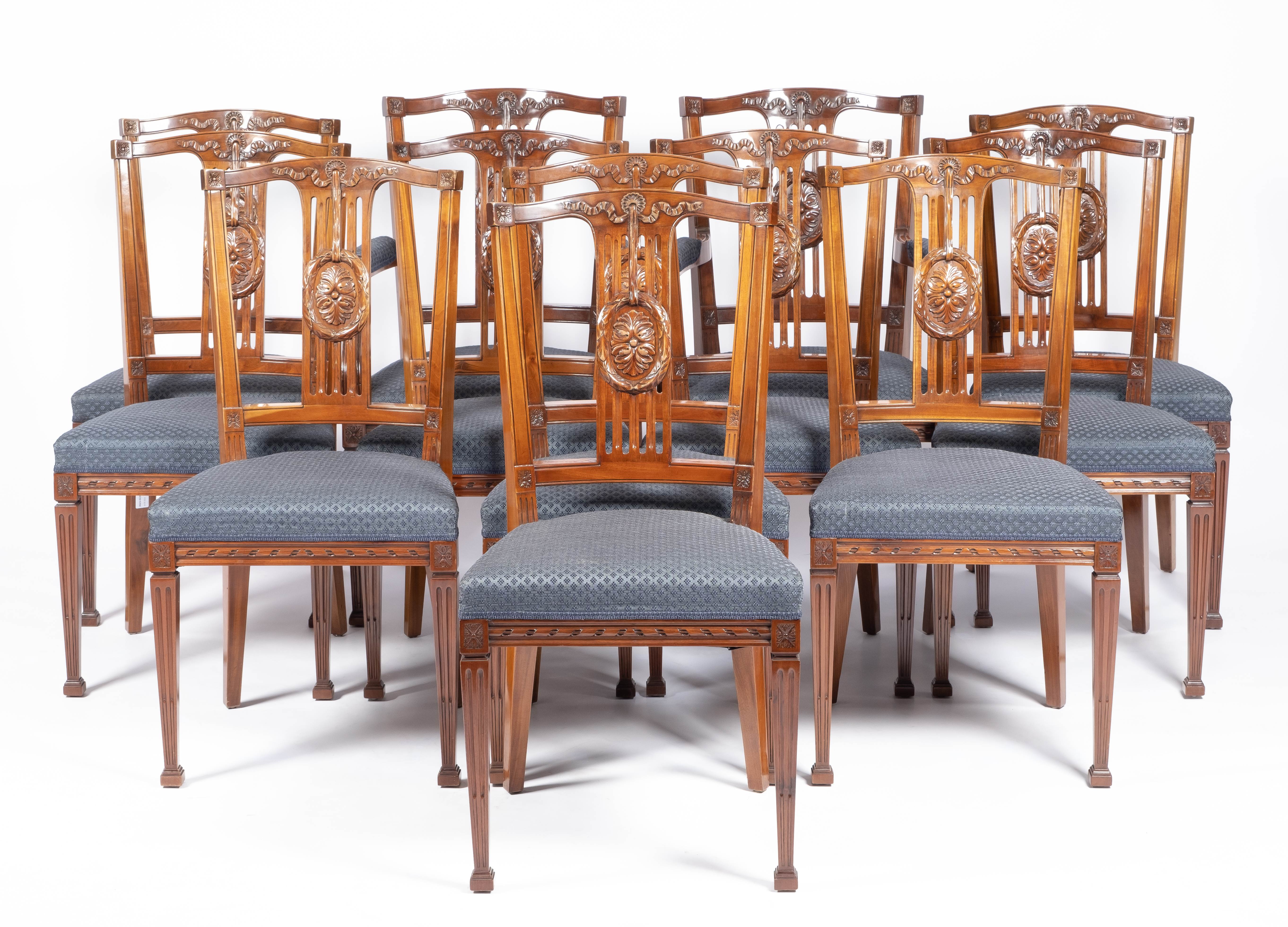 A set of twelve Dutch carved mahogany dining chairs