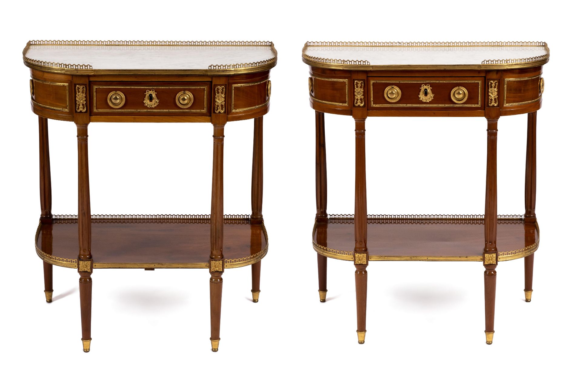 A pair of Louis XVI ormolu-mounted mahogany console dessertes