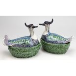 A pair of Delft polychrome pottery lapwing covered dishes
