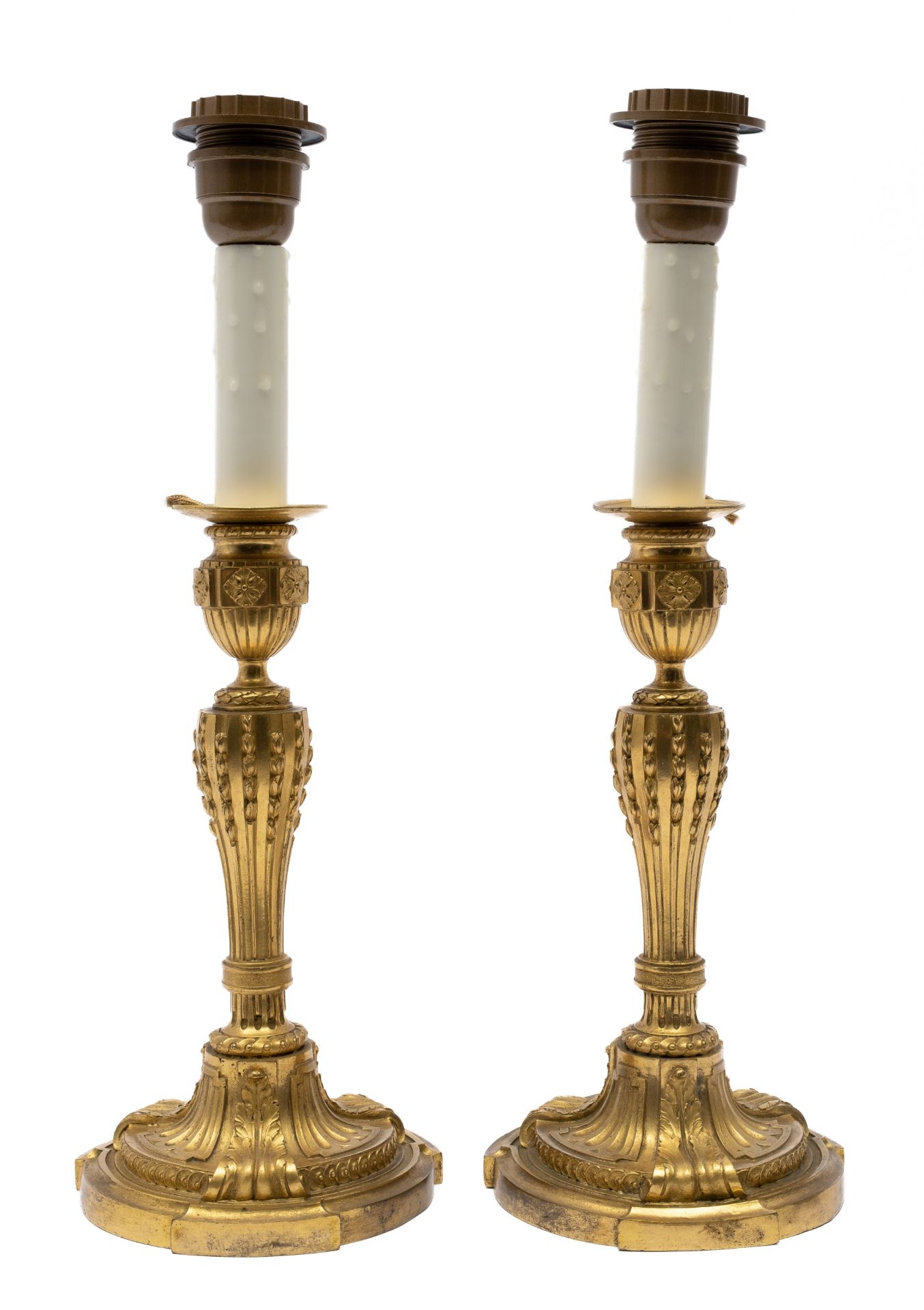 A pair of Louis XVI ormolu candlesticks