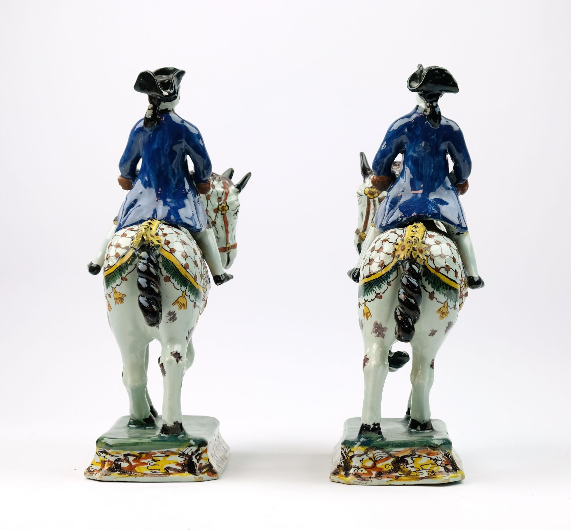 A pair of Delft polychrome pottery horse riders - Image 6 of 8