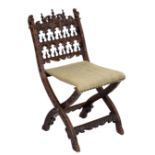 A Dutch carved walnut and ebonised folding chair 'kerkstoel'