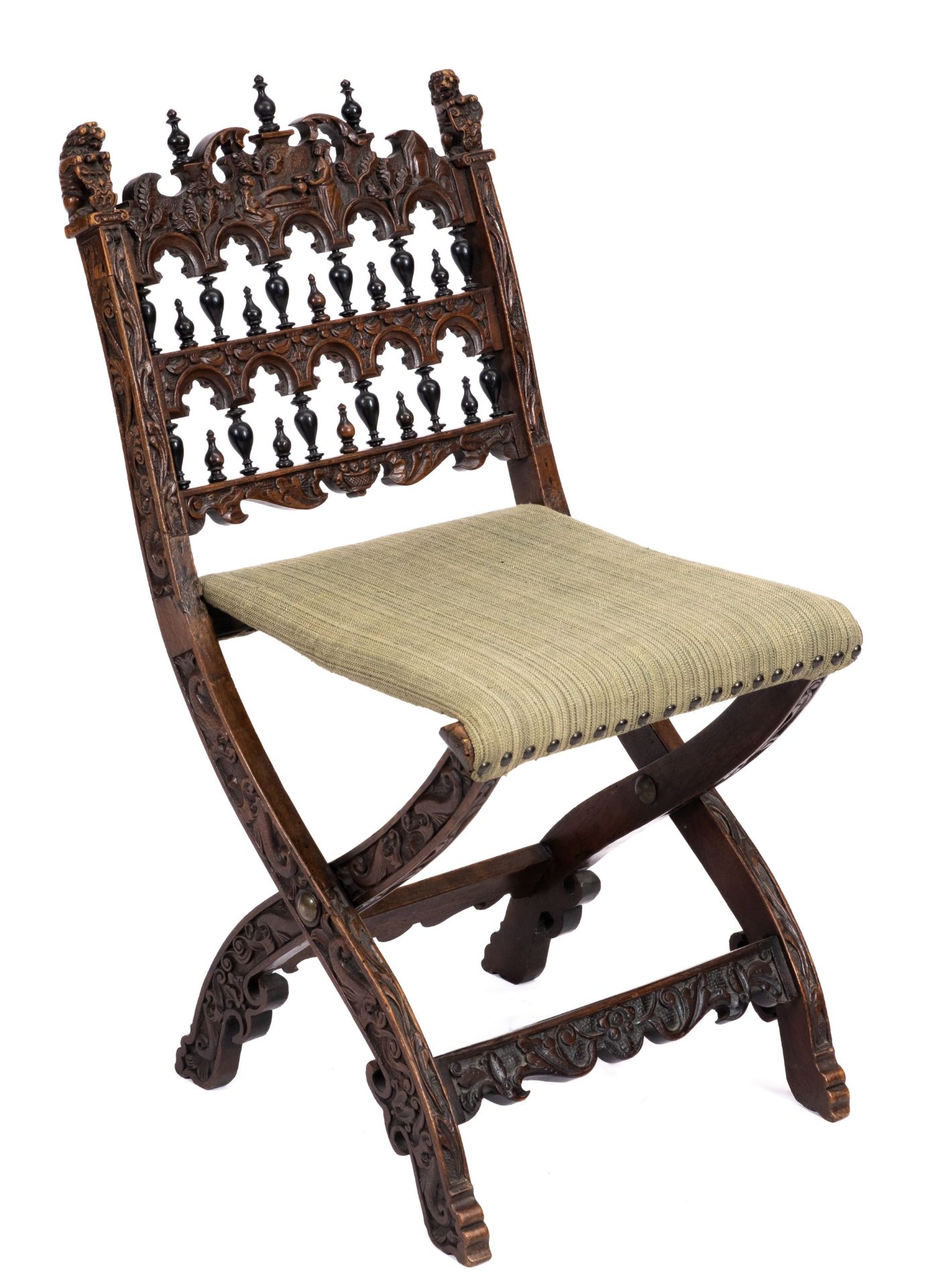 A Dutch carved walnut and ebonised folding chair 'kerkstoel'