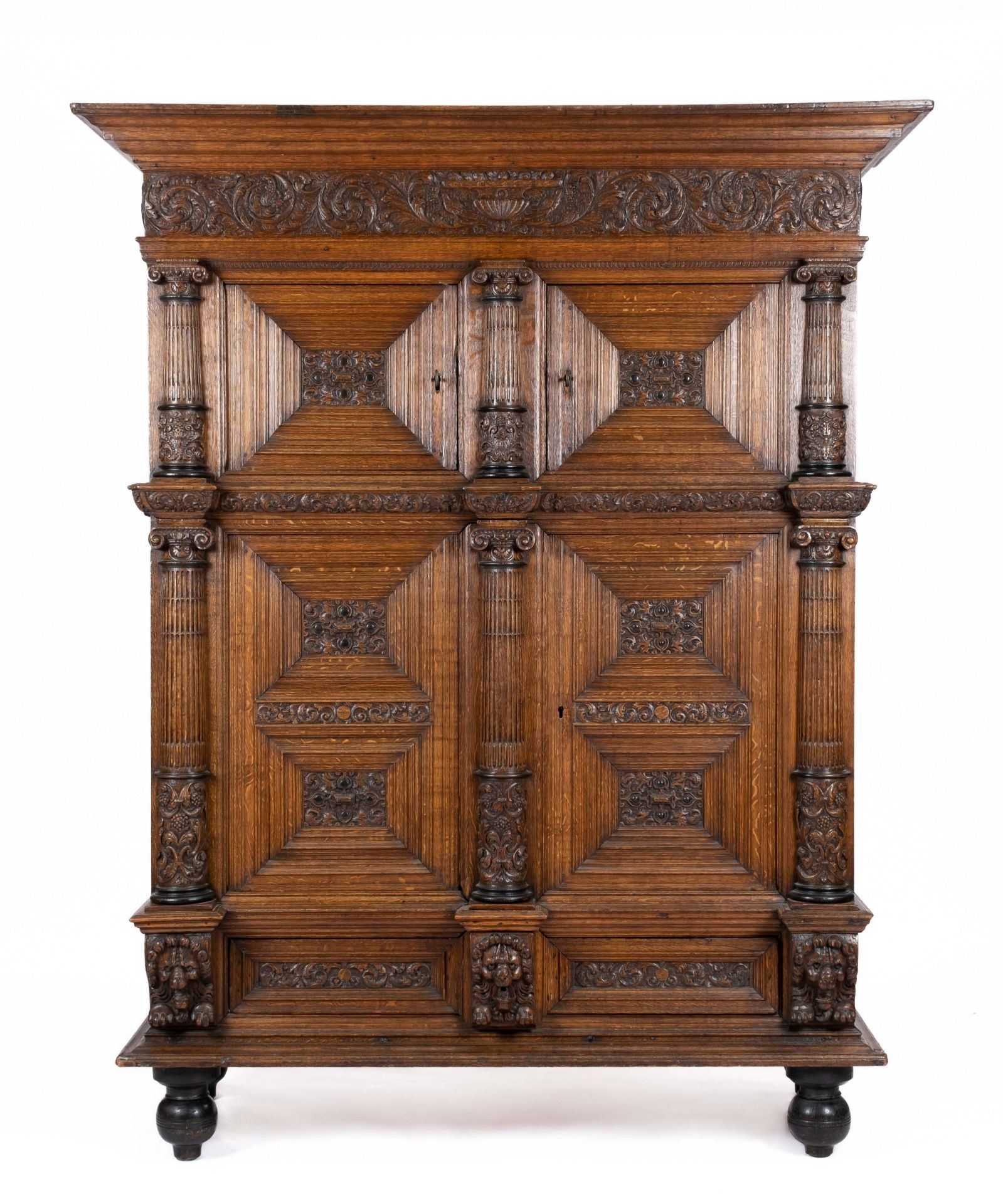 A Dutch carved oak four-door cupboard 'kolommenkast'