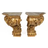 A pair of monumental Italian carved giltwood console tables