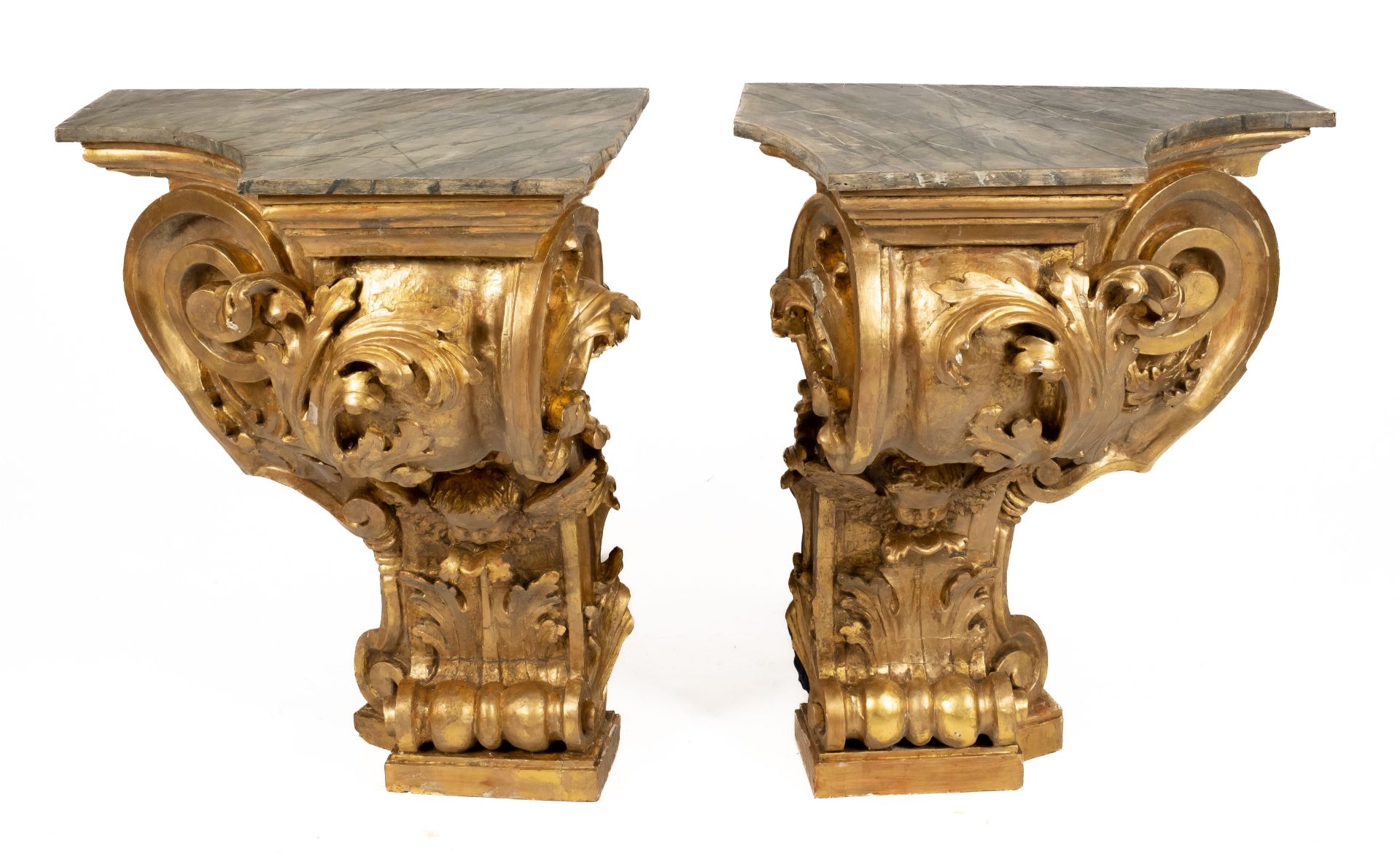 A pair of monumental Italian carved giltwood console tables