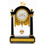 A Directoire ormolu and black marble mantel clock 'pendule portique'