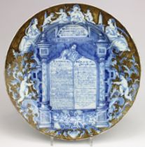 A large Delft pottery charger 'The Ten Commandments'