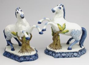 Two Arnhem pottery Delft style prancing horse figures