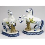 Two Arnhem pottery Delft style prancing horse figures