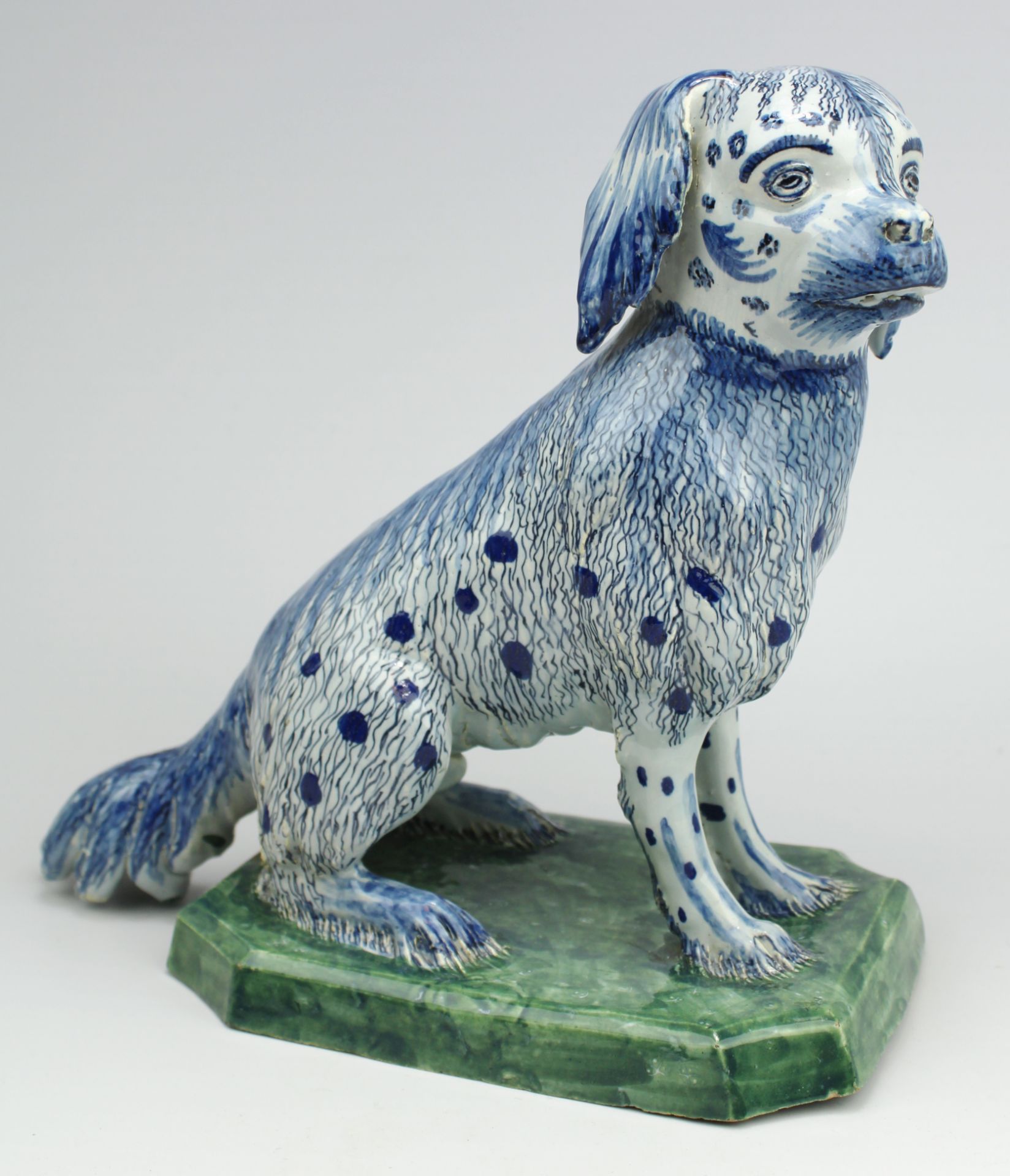 A large Delft pottery figure of a sitting dog