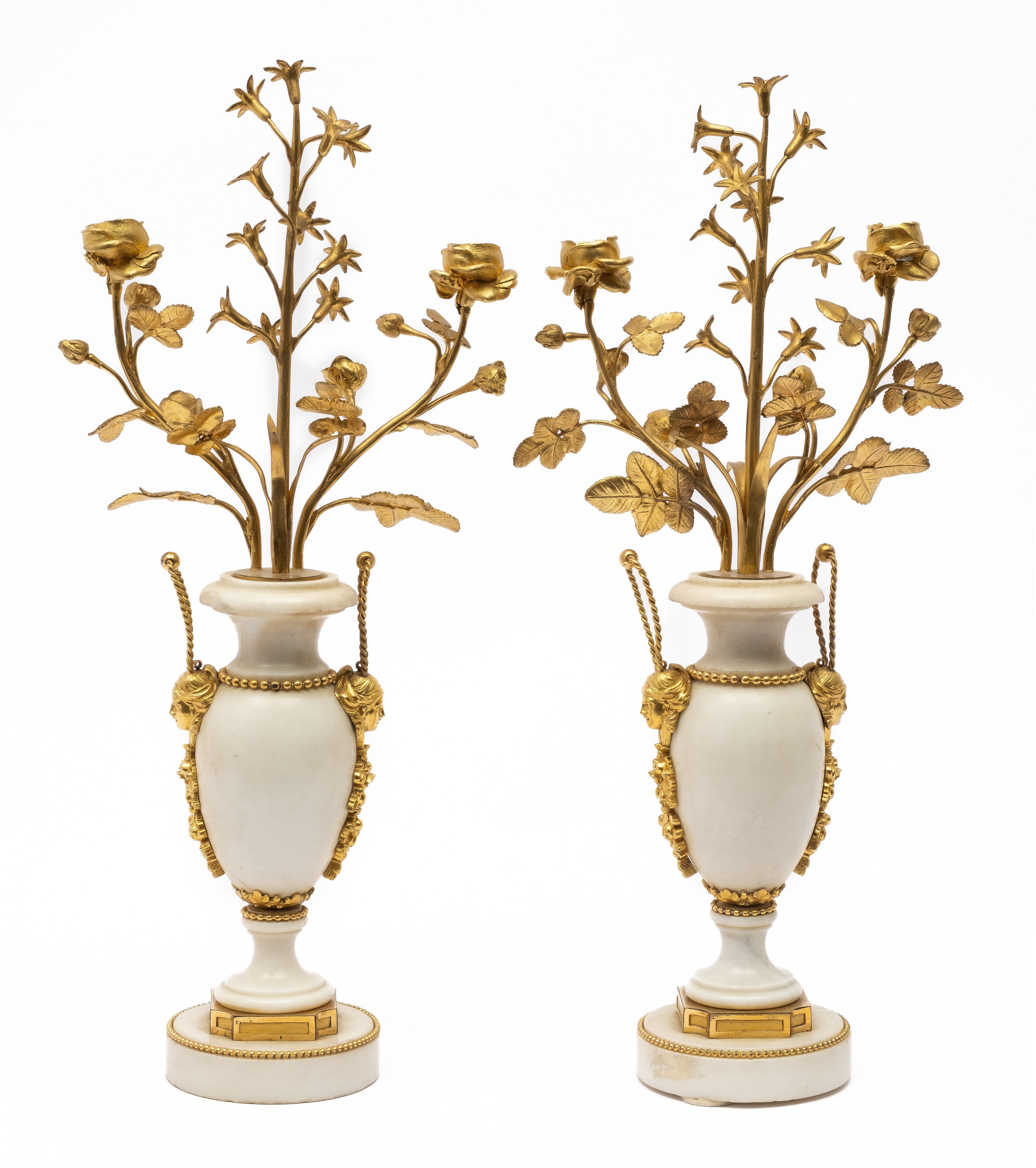 A pair of French ormolu-mounted white marble two-branch candelabra