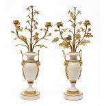 A pair of French ormolu-mounted white marble two-branch candelabra