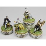 Four Delft polychrome pottery lidded dishes with figures 'The Four Seasons'