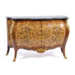 A Dutch ormolu-mounted kingwood, tulipwood, burr-walnut, fruitwood and marquetry commode