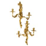A pair of French ormolu three-light wall appliques