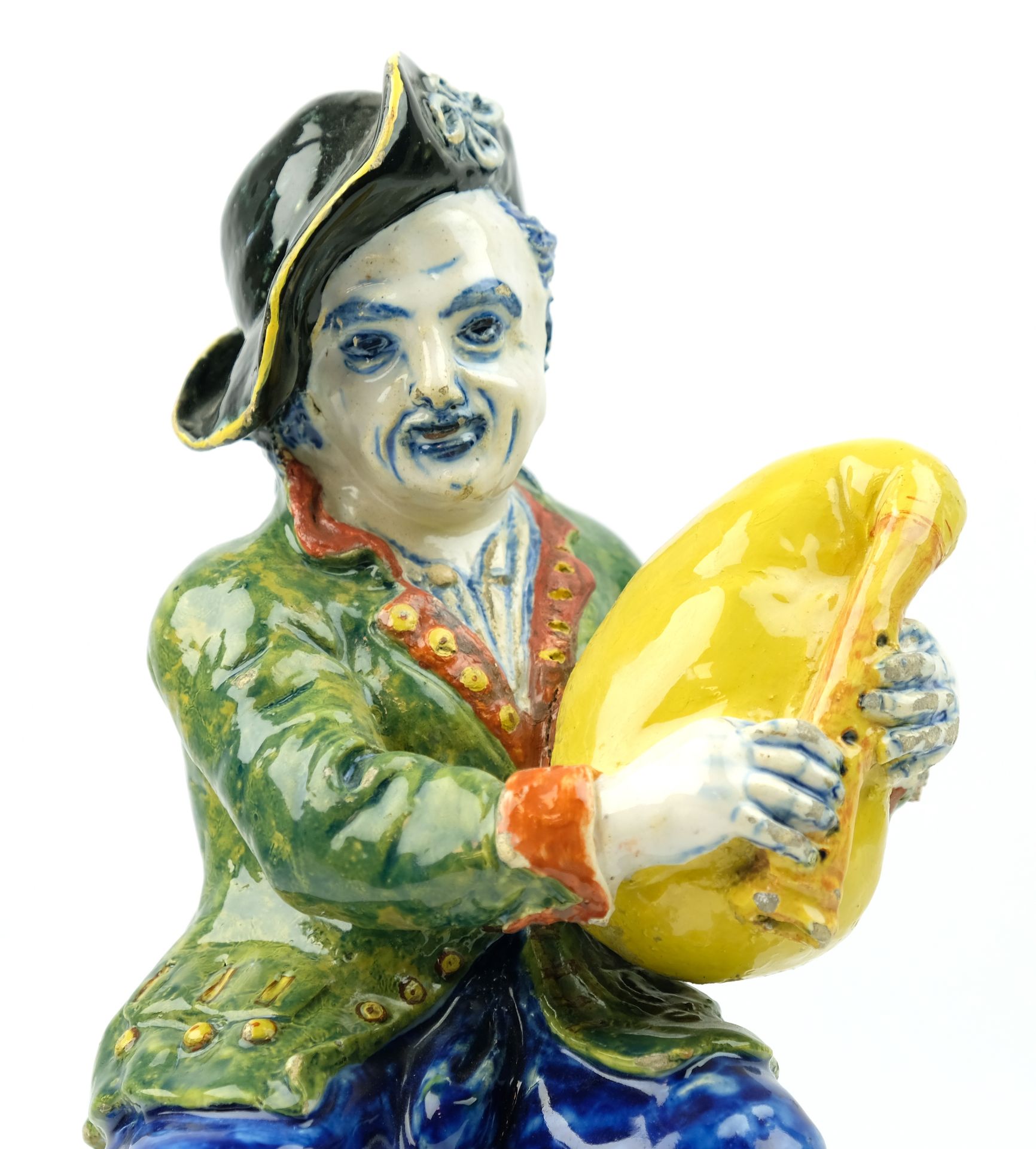 A large Delft polychrome pottery figure of a bagpipe player - Image 5 of 7