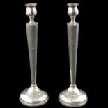 A Pair of Sterling Silver Candlesticks