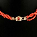 A Three Strand Red Coral Necklace on Gold Clasp