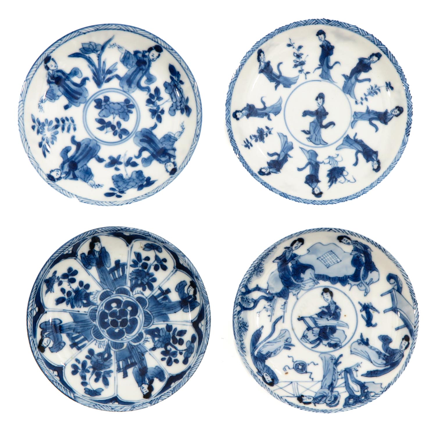 A Collection of 4 Small Blue and White Plates