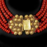 A Five Strand Red Coral Necklace on Gold Clasp