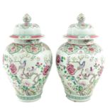 A Pair of Famille Rose Vases with Covers