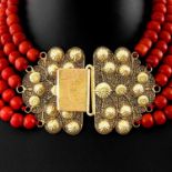 A Five Strand Red Coral Necklace on Gold Clasp