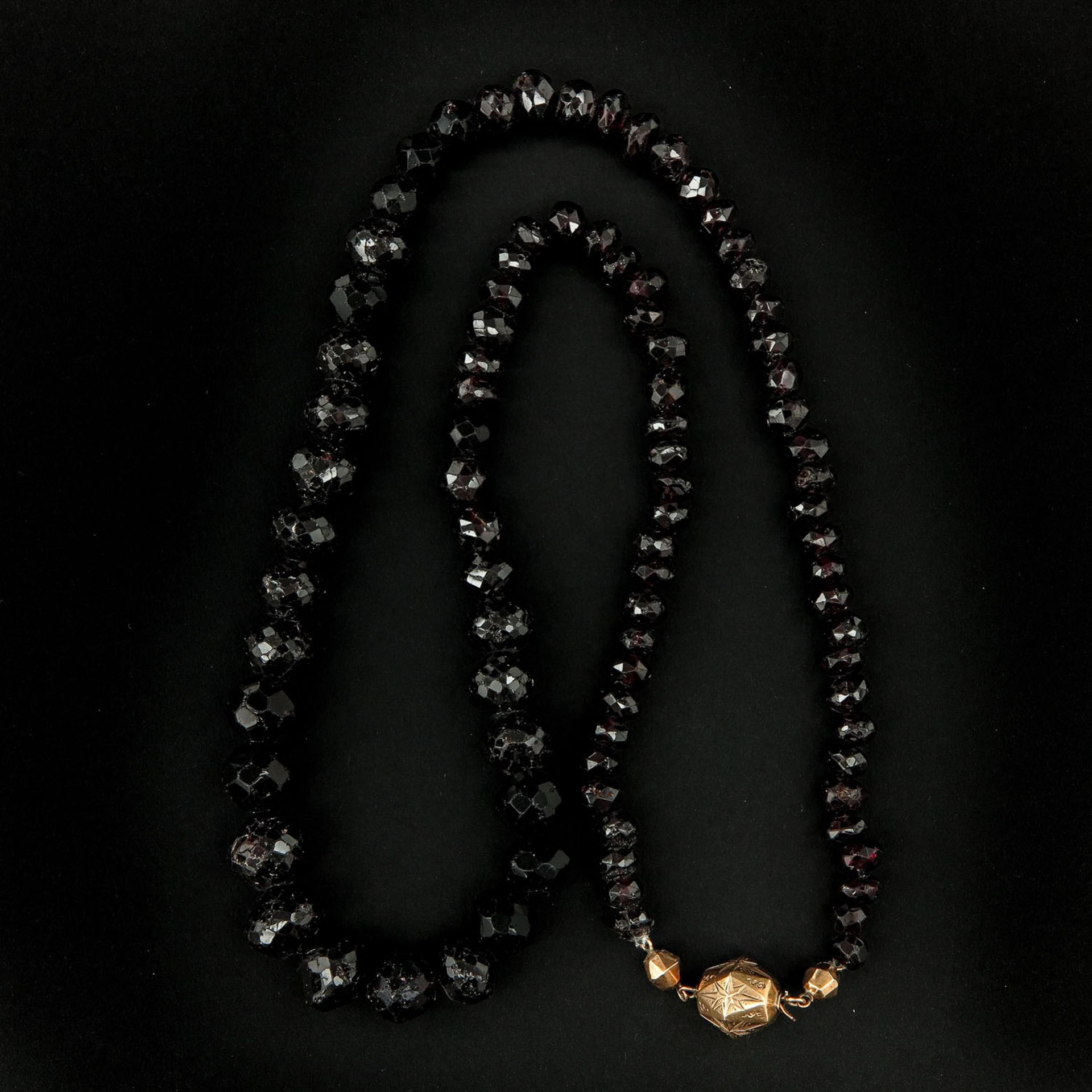 A Garnet Necklace on Gold Clasp