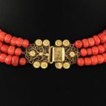 A Three Strand Red Coral Necklace on Gold Clasp