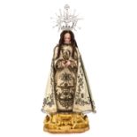 A Beautiful Madonna Sculpture with Silver Crown