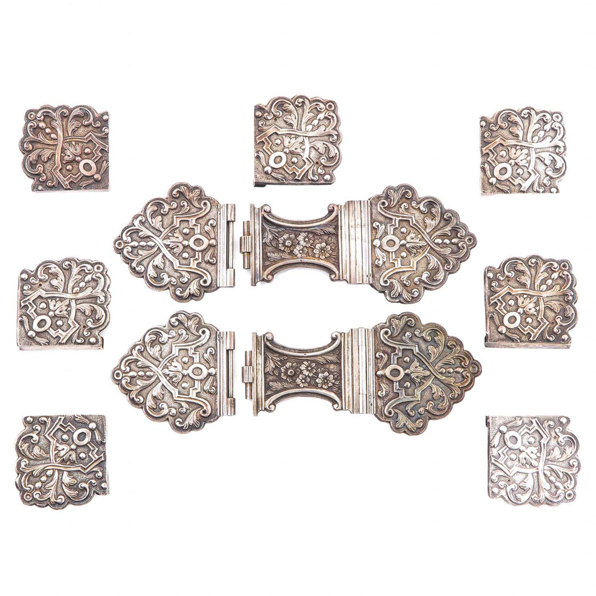 A Collection of 11 Silver Missal Clasp