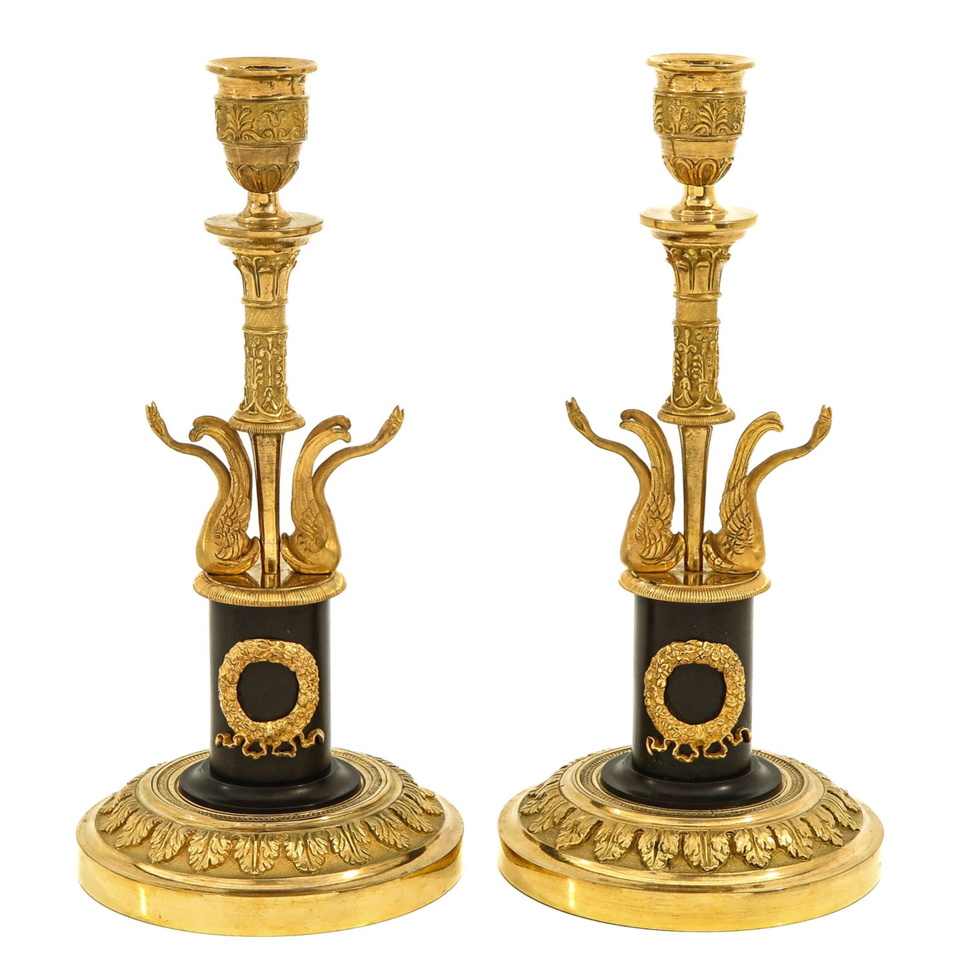 A Pair of Louis XVI Copper Candlesticks