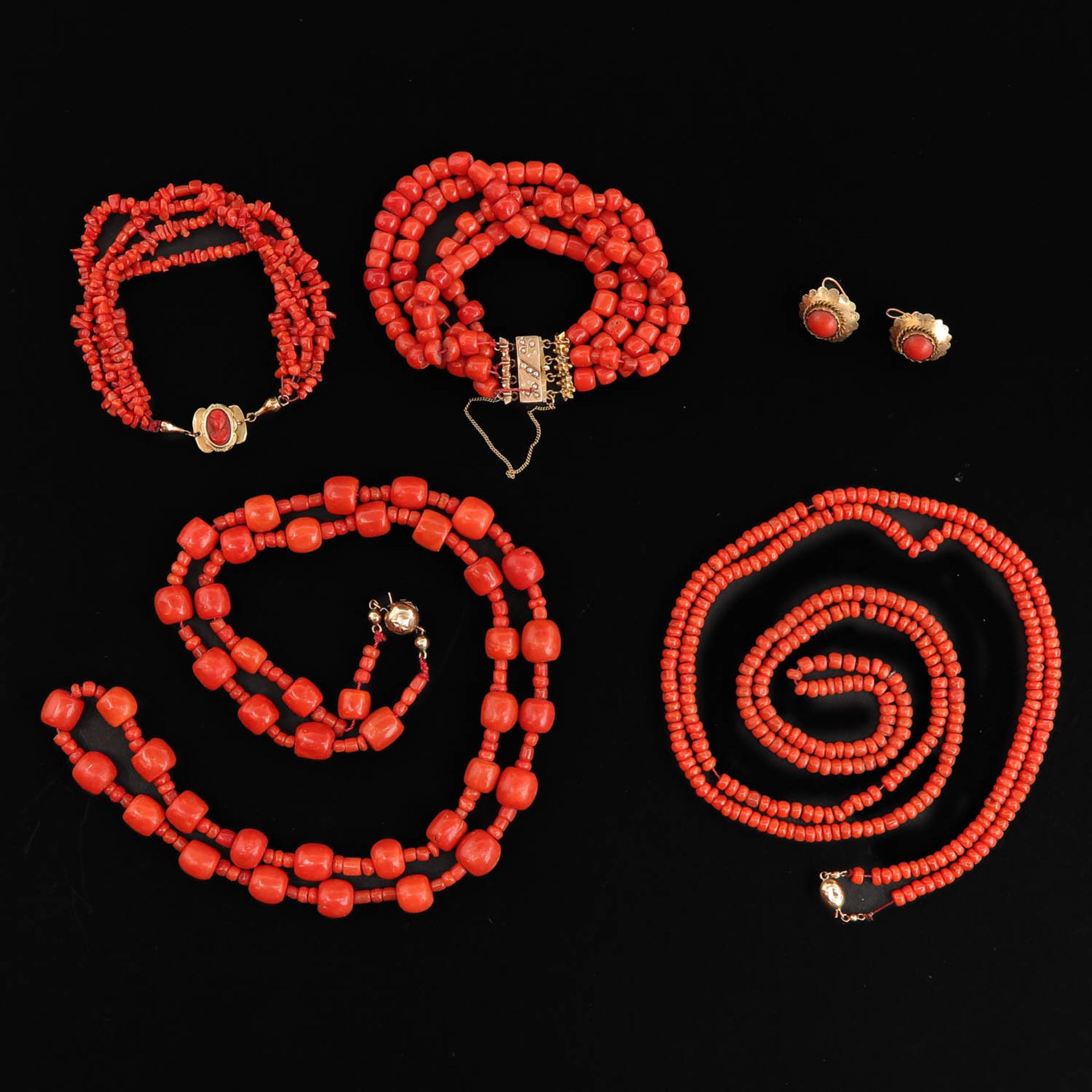 A Collection of Red Coral Jewelry