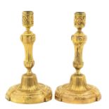 A Pair of Gold Plated Lous XVI Candlesticks