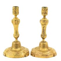 A Pair of Gold Plated Lous XVI Candlesticks