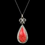 A Carved Red Coral Pendant with Diamonds
