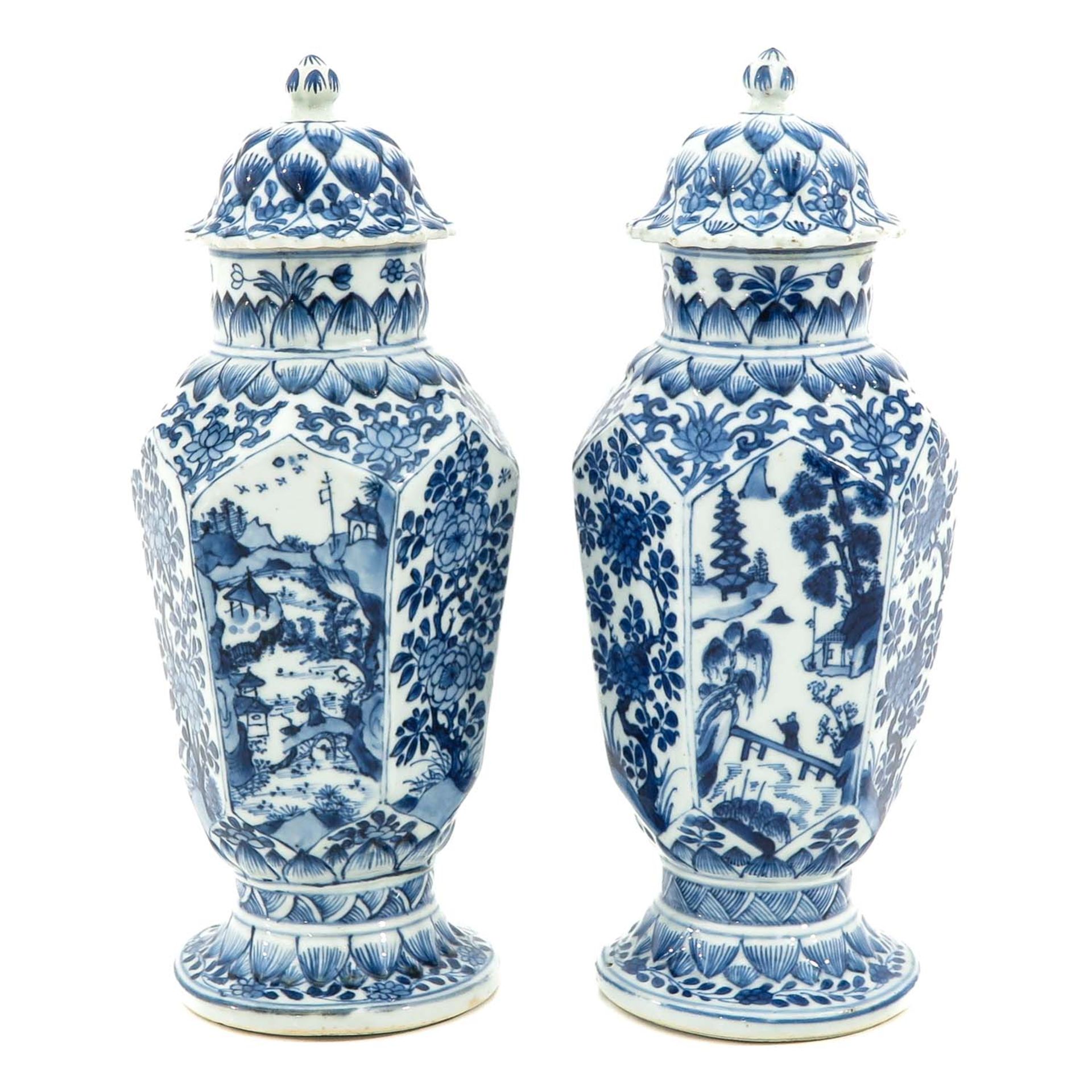 A Pair of Blue and White Vases with Covers