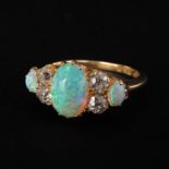 A Ladies 14KG Opal and Diamond Ring
