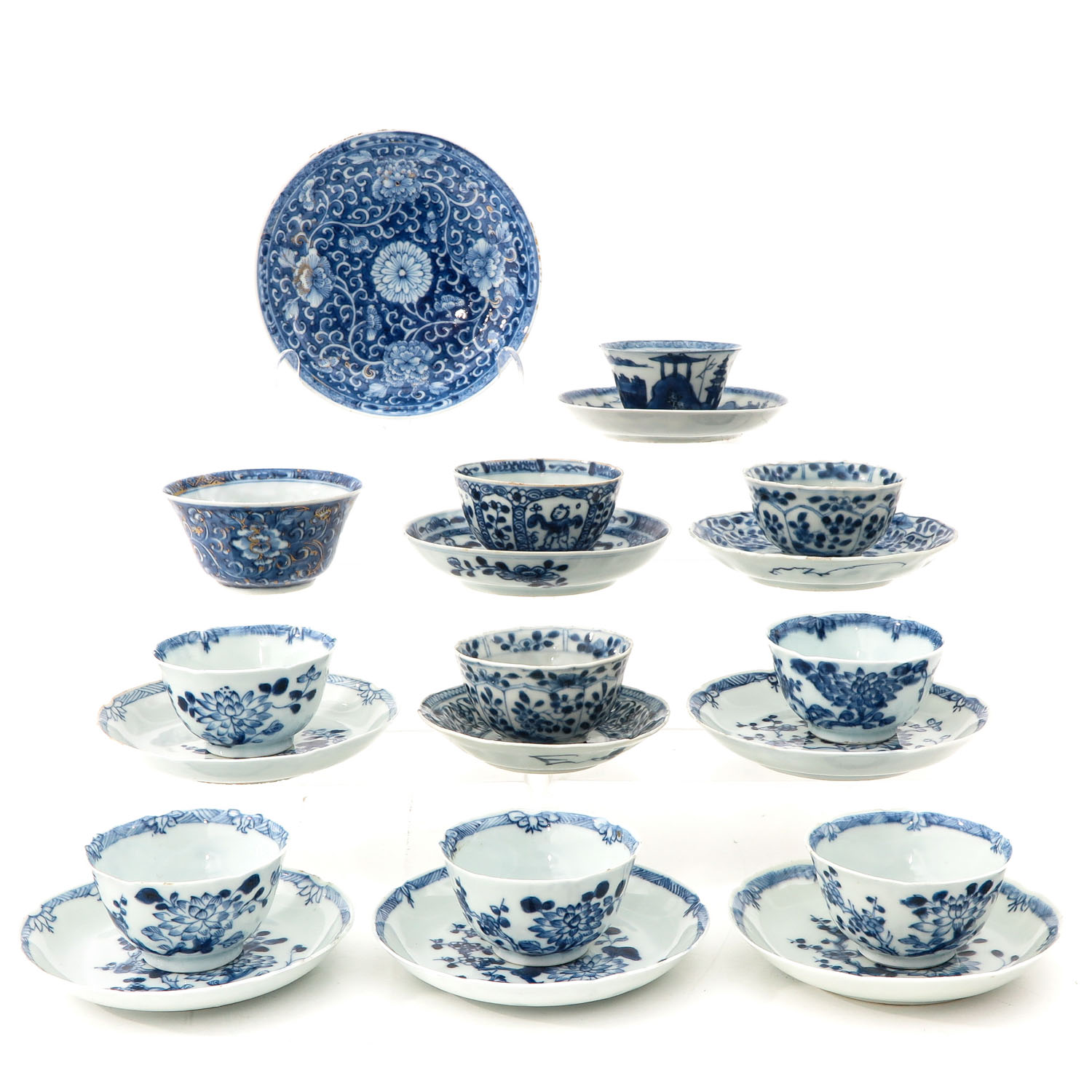 A Collection of Blue and White Cups and Saucers