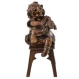 A Bronze Sculpture of Girl on Chair