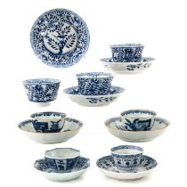 A Collection of Blue and White Cups and Saucers