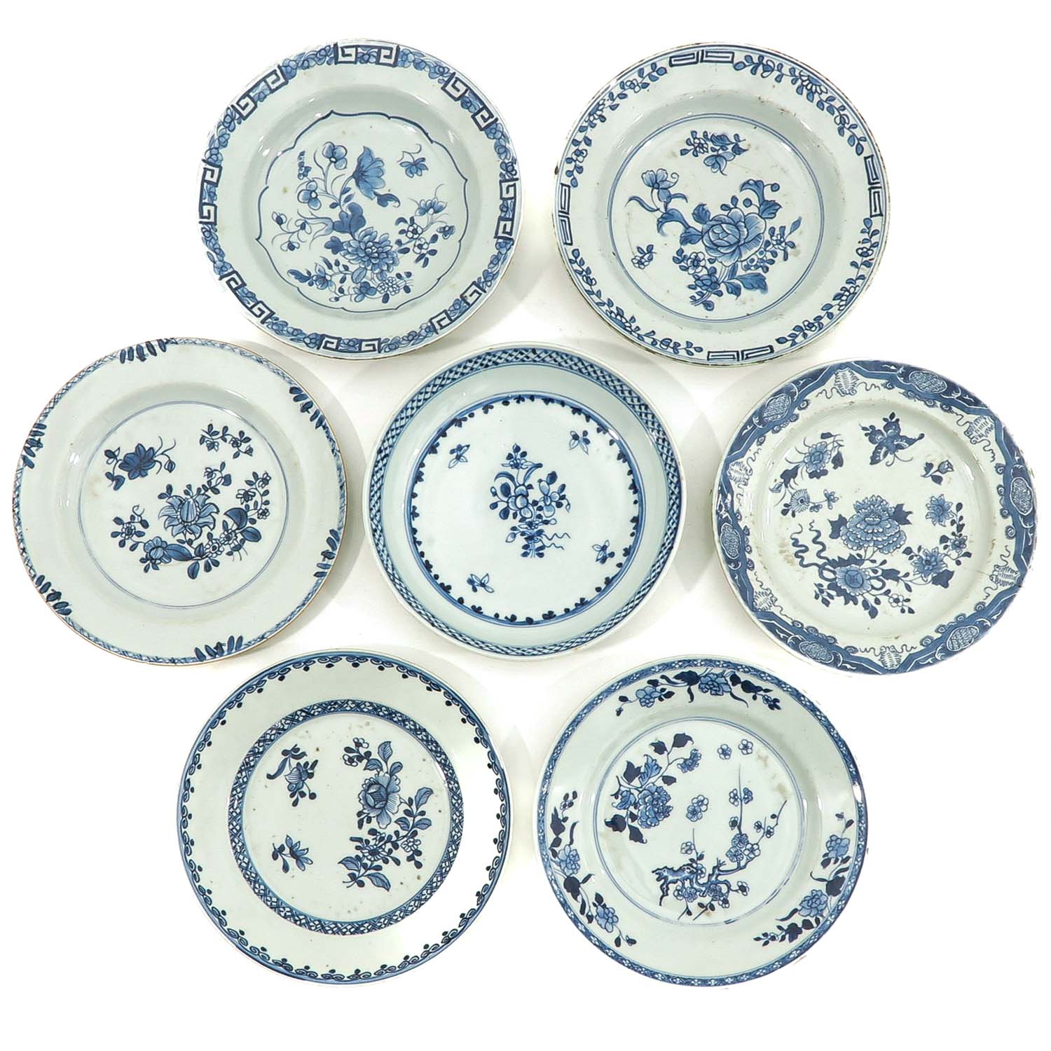 A Collection of 7 Blue and White Plates