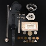 A Collection of Items Including Coins and Jewelry