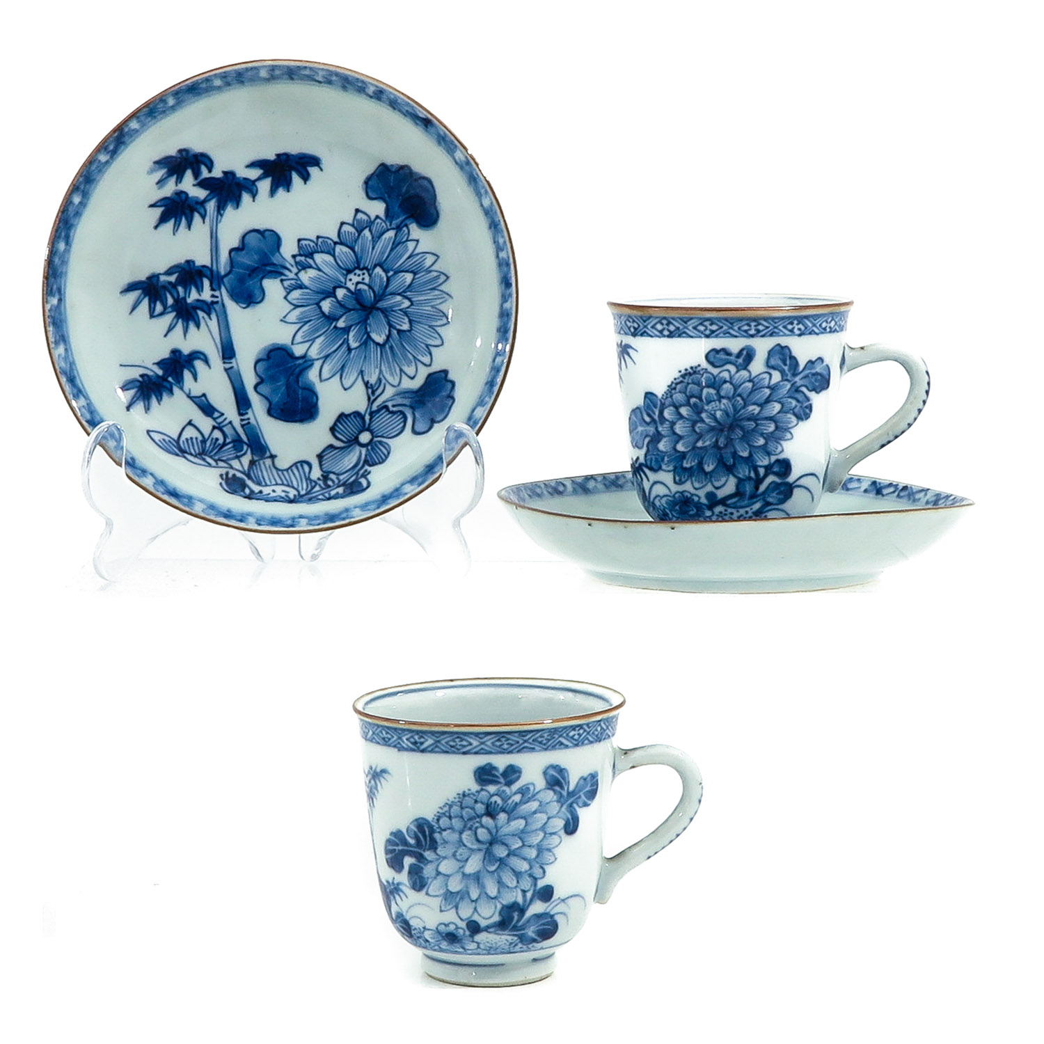 A Pair of Blue and White Cups and Saucers