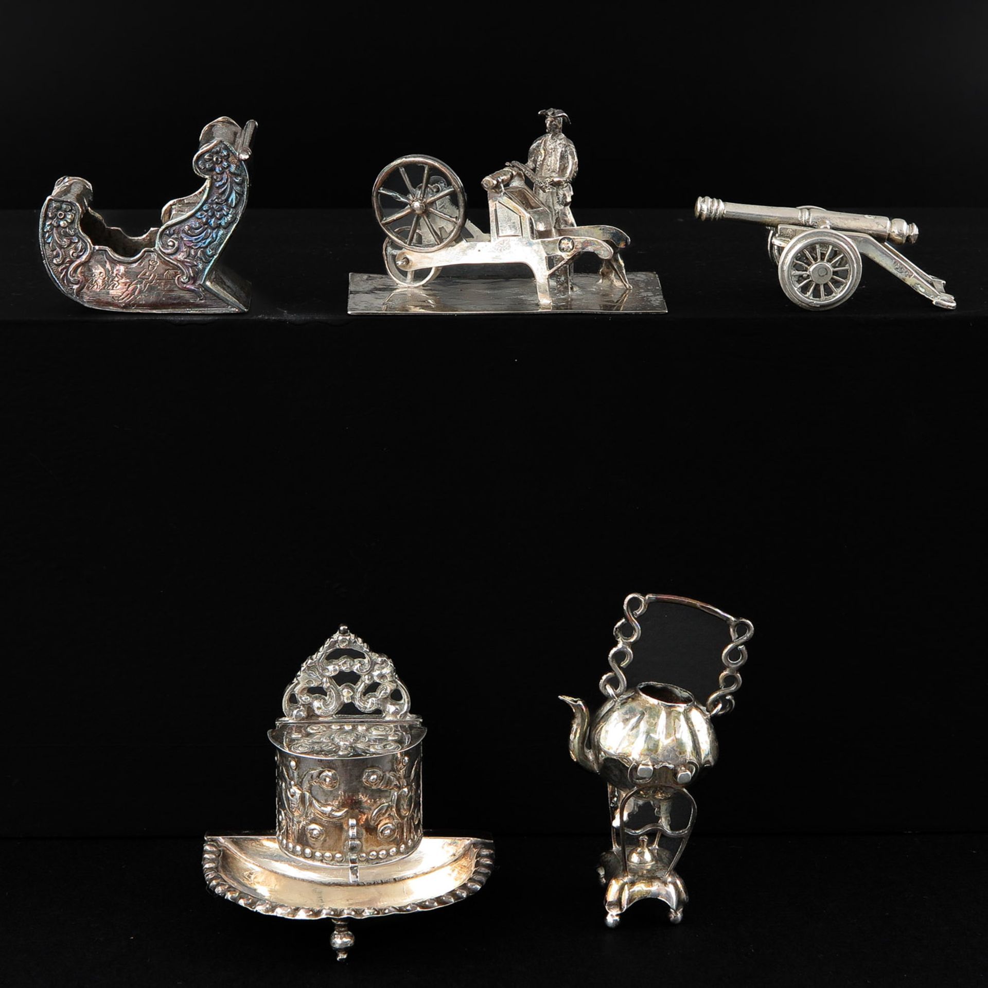 A Collection of 5 Silver Miniatures