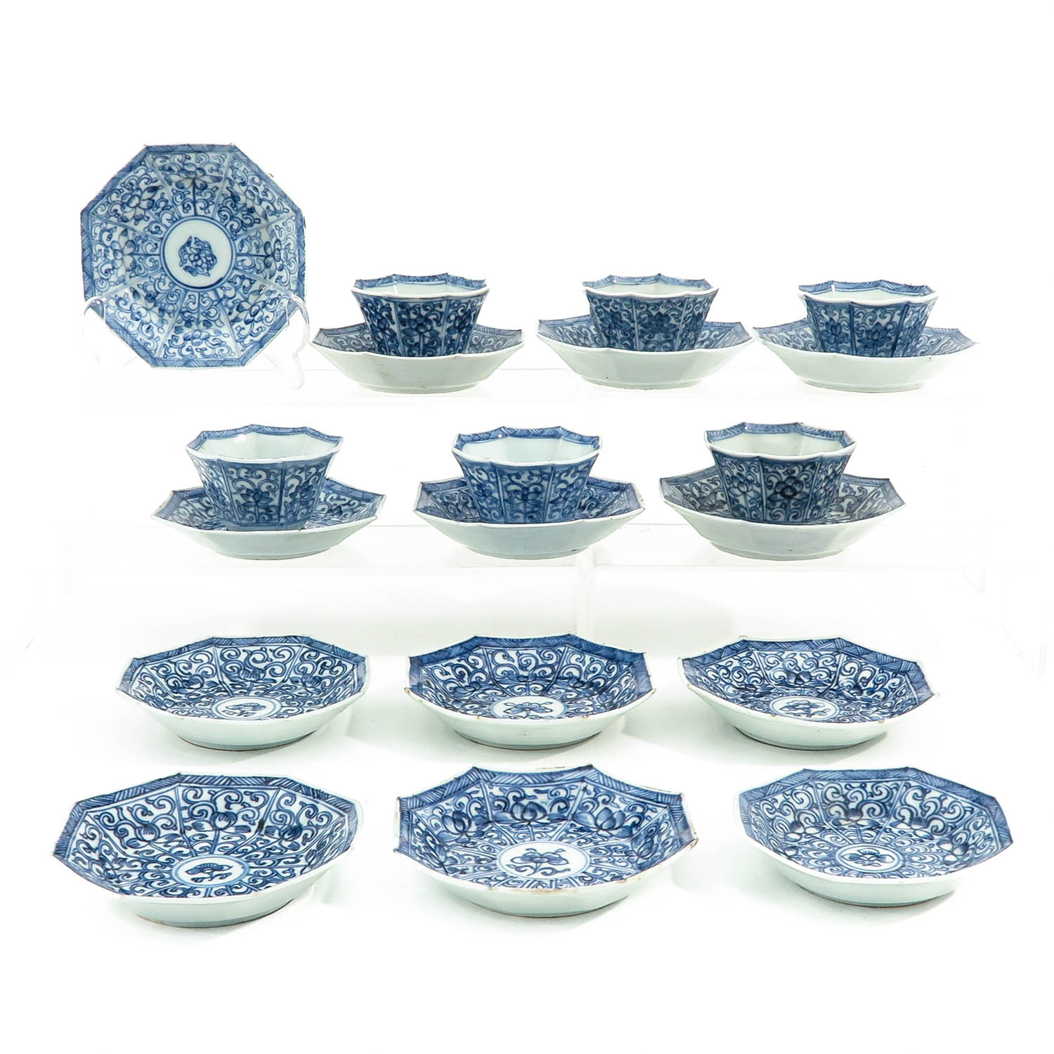 A Series of Blue and White Cups and Saucers