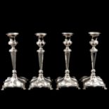 A Series of 4 Silver Candlesticks