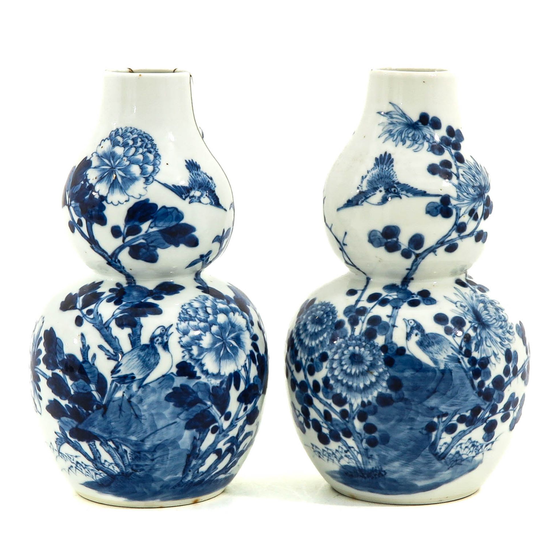 A Pair of Blue and White Gourd Vases